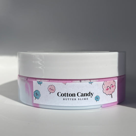 Cotton Candy Slime - Pink and light blue swirl butter slime with cotton candy charms, offering a creamy, smooth texture and sweet cotton candy scent for sensory play.