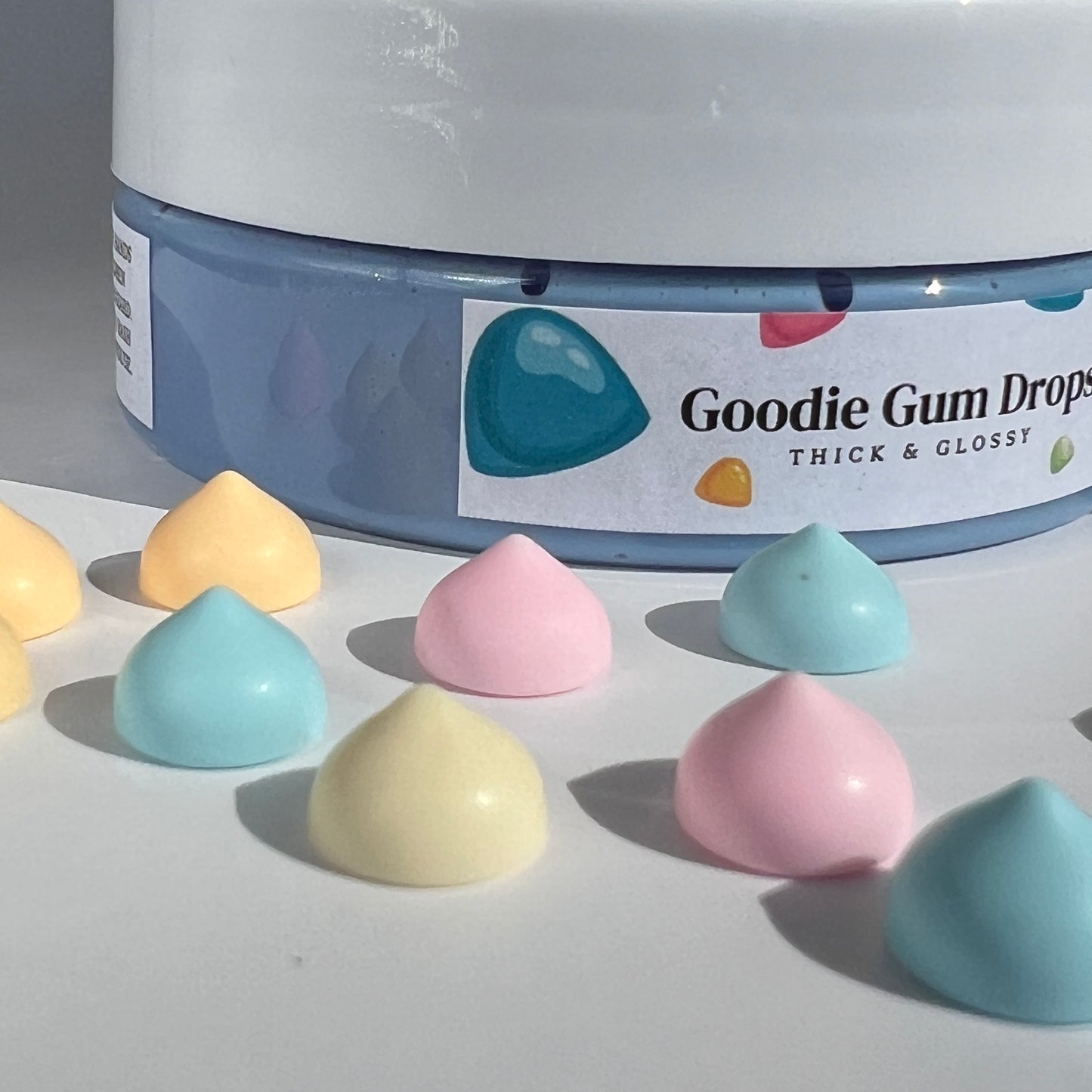 ibrant bluey-purple butter slime featuring a candy scent and playful Goodie Gum Drop charms. A great present for children aged 8-14 for creative and stress-relieving fun.