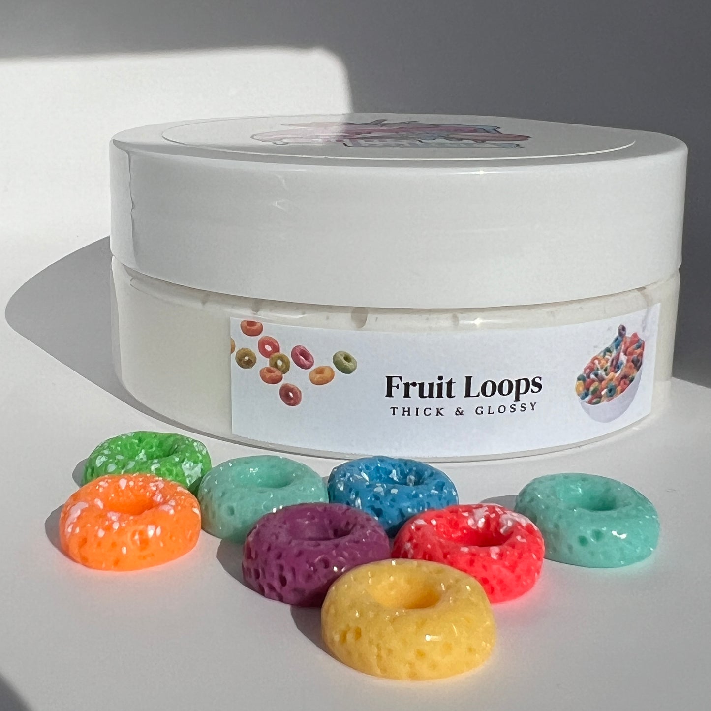 Creamy, multi-coloured butter slime with a smooth, spreadable consistency, embellished with acrylic Froot Loop charms. Delivers a playful Froot Loop scent and engaging tactile experience