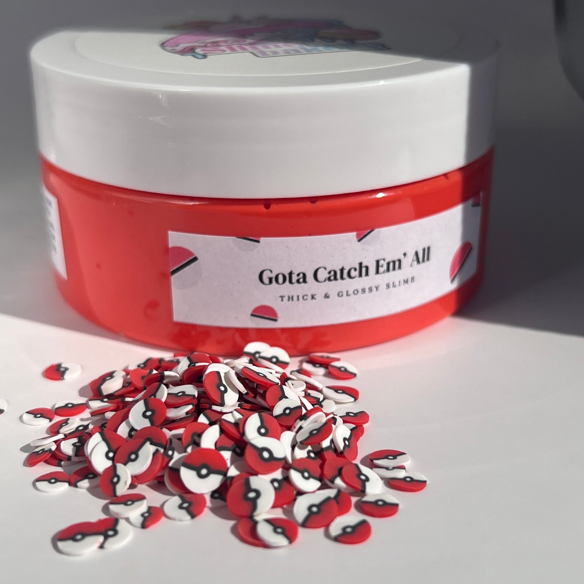 Toffee Apple Scented Pokémn Slime - Smooth butter slime with vibrant colour, Pokémn ball sprinkles, and themed polymer charms. A great gift idea for Pokémn enthusiasts.